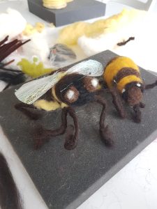 Striped felted bees.