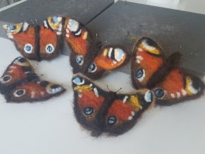 Falling peacock butterflies