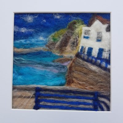 staithes felting of north yorkshire harbour. wool felting, bright seascape, strong blue colours.