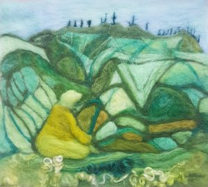 needle felted Swiss landscape with swami seated in meditation, green tones with pale blue sky, textured mountains wool texture, painting in wool, shades of green wool, 3D relief landscape of Swiss Alps.
