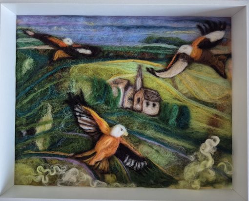 red kites over Amberley, Stroud. needle felted birds in green lush landscape, textural rolling hills, dark greens lime green fields with bright orange wings of the red kite birds flying soaring above Amberley fields.