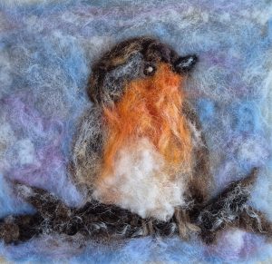 Learn how to felt a Robin picture, orange, brown, grey wools. 