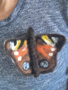 Needle felted peacock butterfly, wool felting workshops.