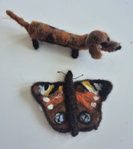 Felted dachshound, needle felted butterfly, wool felting workshops